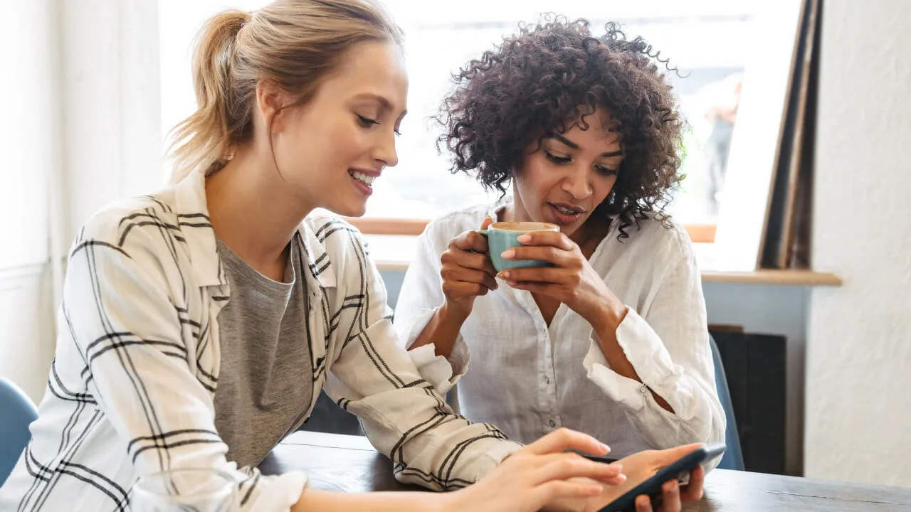 Women looking at mobile phone